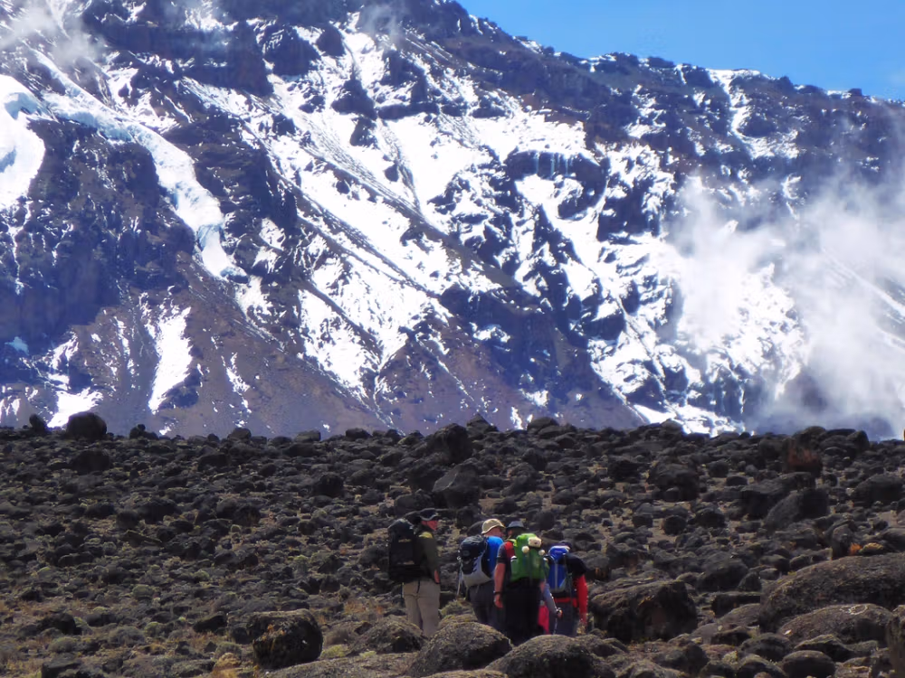 Climbers nearing Kilimanjaro summit at dawn